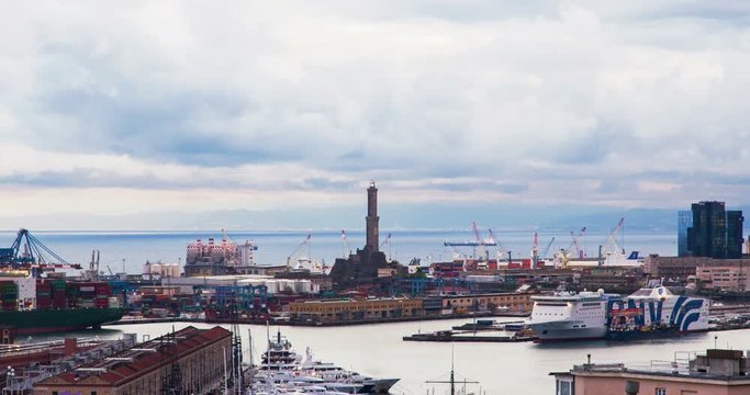 GENOA, ITALY - April 27, 2017: Lighthouse and harbor in the clouds during sunset, timelapse.