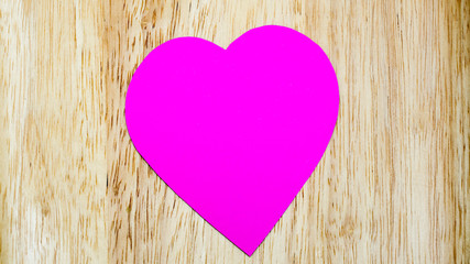 paper heart pink on wood  background