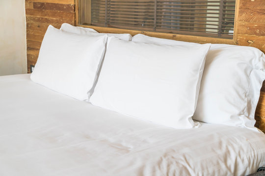 white pillow on bed