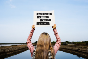 Young Woman Hands Holding Blank Paper with Life Motivation Phrase