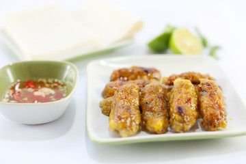Baked rolls in vietnamese style with fish sauce and lime