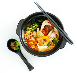 Hot chili ramen noodle with seafood in black stew