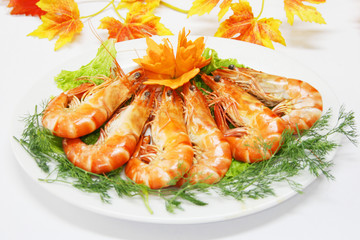 Steamed shrimp with cummin leaves on white dish