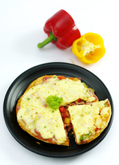 Pork pizza with bell chili on black platter