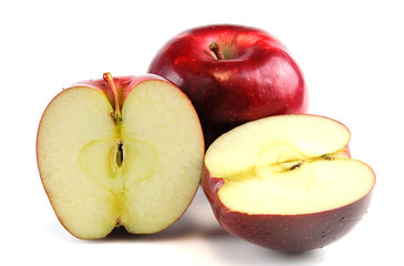 red apple with one cut in half on white background