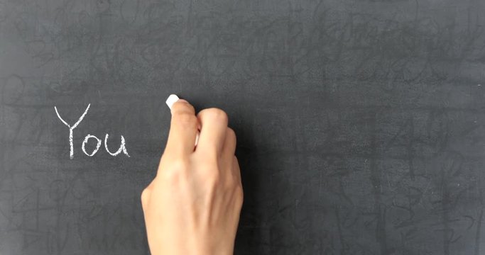 Chalk writing - You Only Live Once on chalkboard 