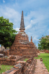 Fototapeta premium Ruins of buddha statues and pagoda of Wat Phra Si Sanphet in Ayutthaya historical park, Thailand