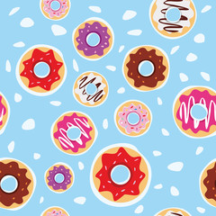 Fototapeta na wymiar seamless donuts pattern with blue background vector design