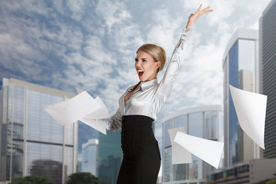 Woman Throwing Paper Pages