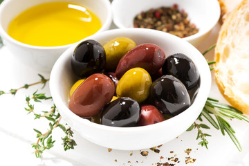 fresh organic olives, spices and bread, closeup