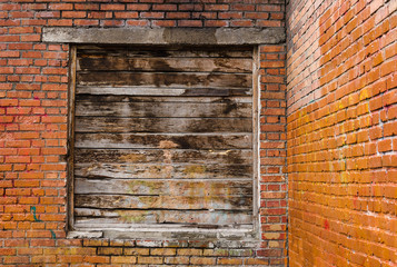 Brick wall with a blocked opening