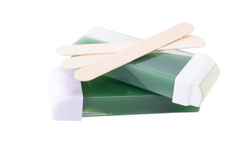 concept of the wax and wooden sticks for the hair, isolated on white background