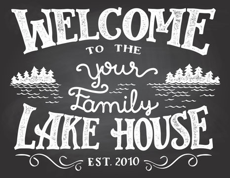 Welcome to the your family lake house chalkboard sign. Replace YOUR with the surname you need. Hand-drawn typography sign on blackboard background with chalk