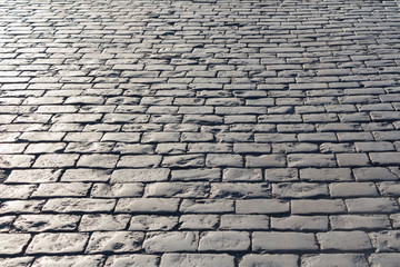 Pavement background in sunny day, cobblestone, Red Square, Moscow