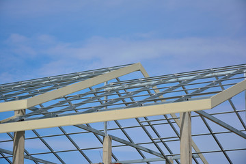 Home roof steel structure on blue sky background.