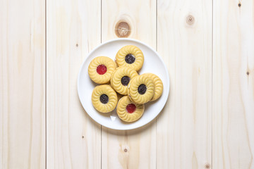 Cookie biscuits on wooden table, flat lay