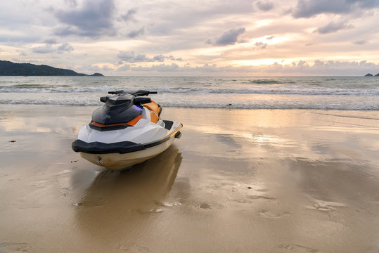 Jet ski parking on the Beach with sunset background.
