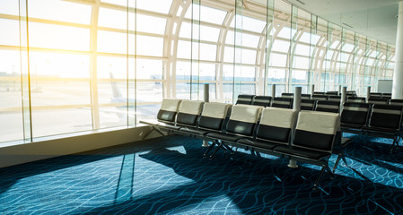 Obraz premium Group of chair at international airport termina in travel concept with sun light.