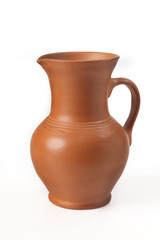 Fototapeta na wymiar Pitcher ceramic (handmade) with handle. Isolated on white background