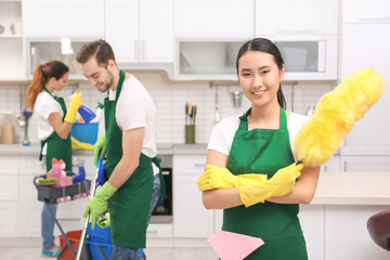 Cleaning service team at work in kitchen
