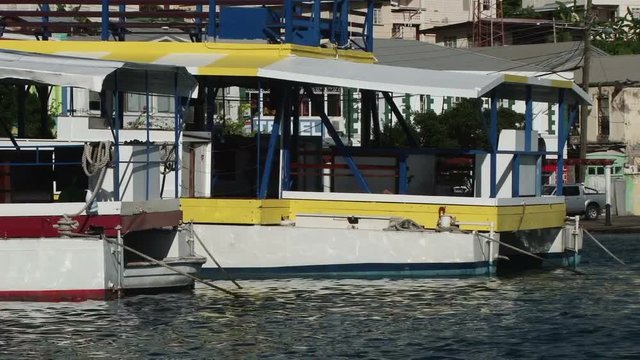 Shot of tour boats moored in St George’s Inner Harbour, Grenada on the sunny day