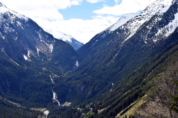 Beautiful alpine landscape from Gerlos Pass, Austria. Snow-capped montains, Krimml Waterfalls and valley.