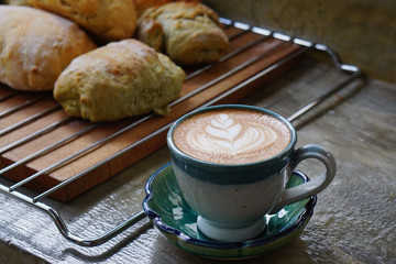 Hot Mocha - A cup of coffee with beautiful latte art on cement background, Morning breakfast.