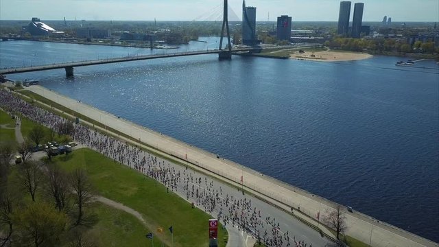 Aerial View of Marathon, Runners run at the Riga International Marathon along Daugava River on May 14, 2017 in Riga, Latvia, View from Above