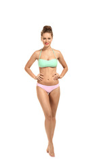 Fototapeta premium Beautiful young woman in swimsuit on white background