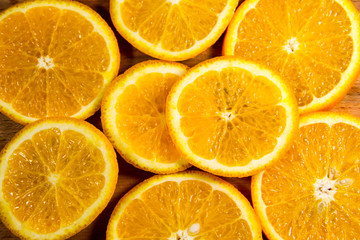 Fototapeta na wymiar Background of sliced juicy oranges fruit