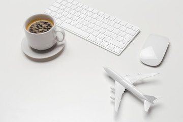 Obraz na płótnie Canvas Aircraft and laptop keyboard