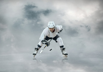 Fototapeta premium Ice hockey player on the ice, outdoors