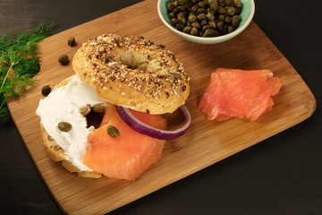Bagel with cream cheese and lox, place for text