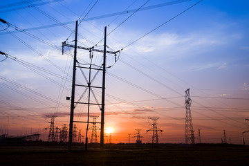 Fototapeta premium The silhouette of high voltage towers