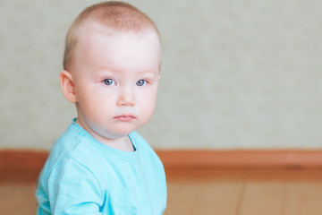 baby bored face at home