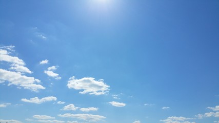 Beautiful blue sky with clouds and sun