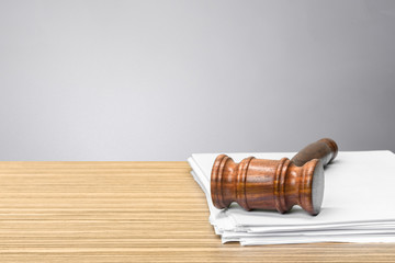 judge hammer on white paper and table