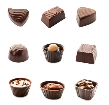 Set of delicious chocolate candies on white background