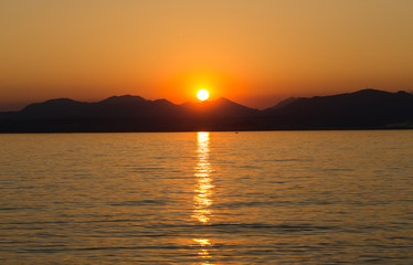 Fototapeta premium Beautiful sunset at Garda lake in Italy