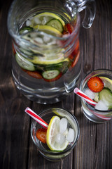 Water with lemon strawberries and cucumber