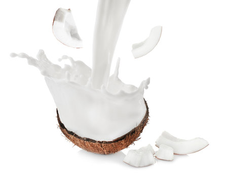 Coconut half and pieces on white background