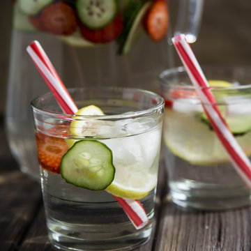 Water with lemon strawberries and cucumber