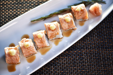 Top View Sushi Roll On White Plate , Japanese food style , Selective Focus.