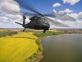   Black Hawk military Helicopter in flight - aerial view close up © Riko Best