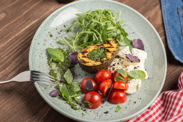 Appetizer of avocado and mozzarella cheese