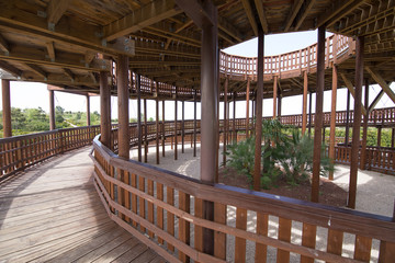 rise circular ramp of wooden lookout tower, with columns and interior garden, in public park named Felipe VI or Forest Park Valdebebas, in Madrid city, Spain
