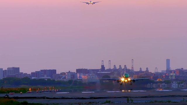 Jet plane taking off in sunset
