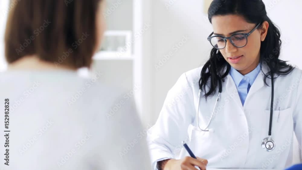 Poster doctor talking to woman patient at hospital