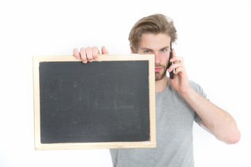 man with smartphone and blackboard