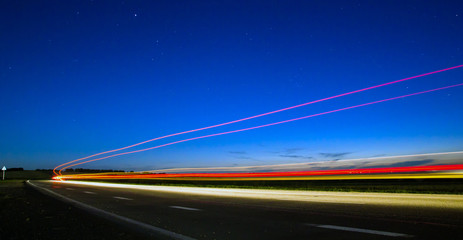 Photo of country road with traces of light vehicles